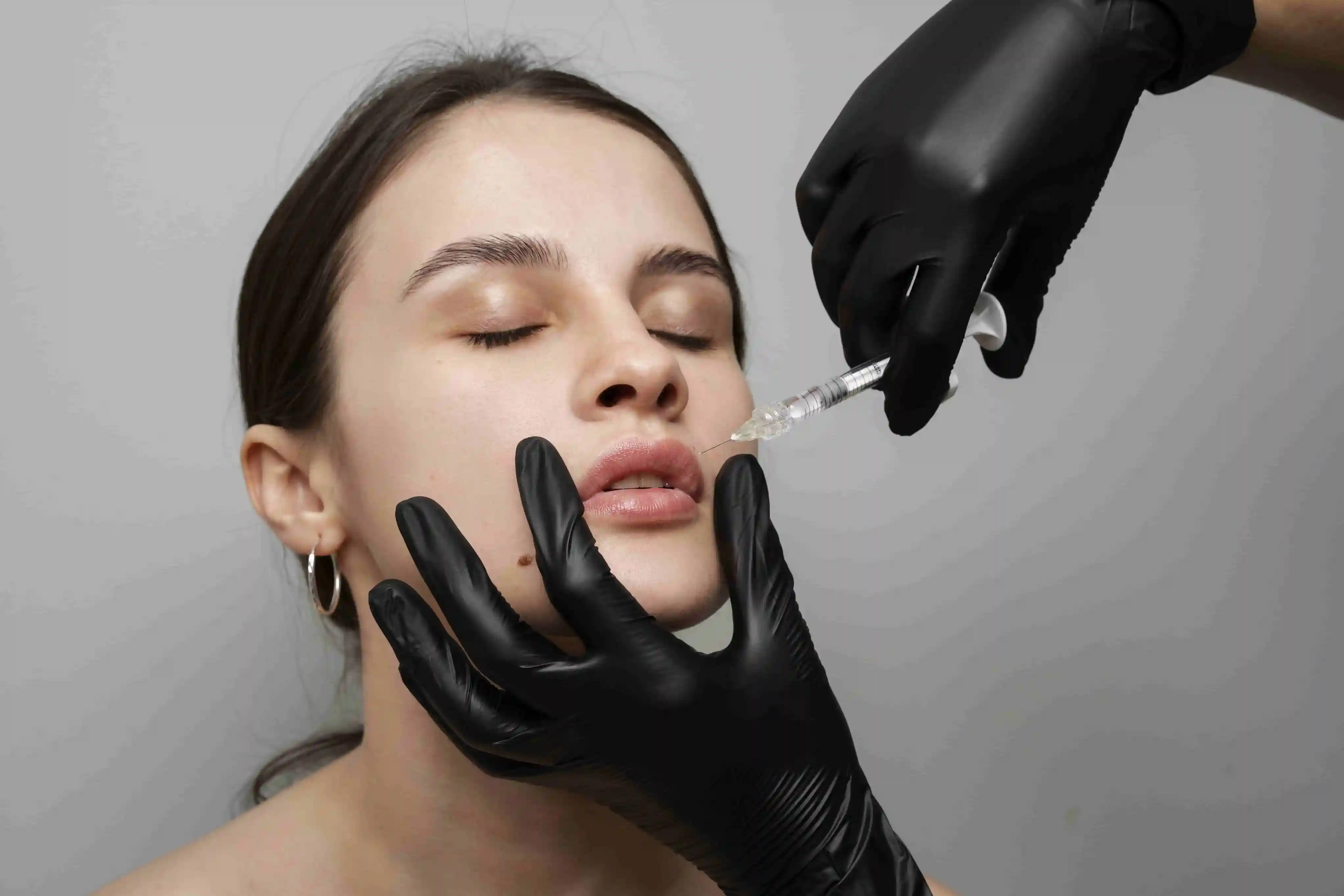 woman getting lips injection